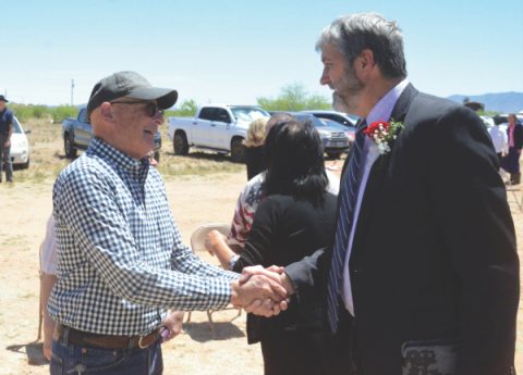 Elder Ed Keyes greets a member of the church leadership team that previously owned the property that the Stronghold International Mission Group now calls their church.  