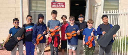 Students at Yuma Adventist Christian School with their string instruments.